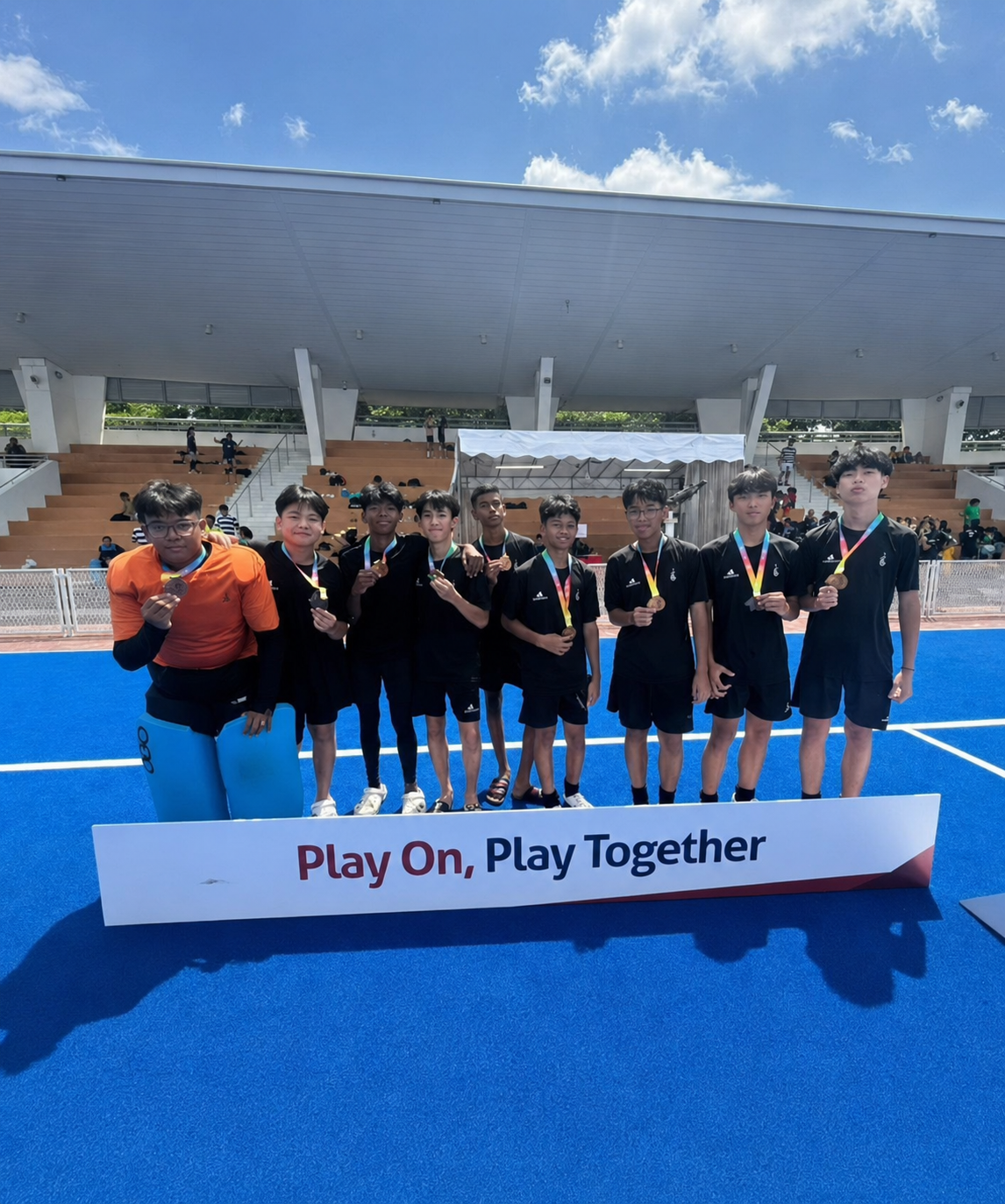 hockey boys posing after their winning match